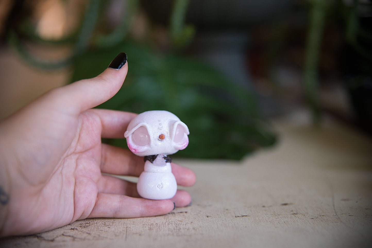 SALE! Snowmish with rose quartz eyes, holding rose quartz #98