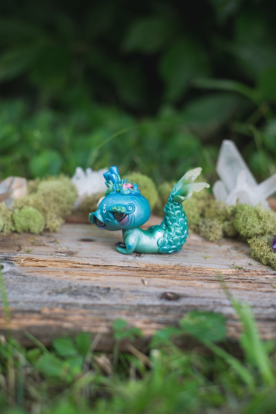 Left-Side View of Blue & Green Mermish - handmade polymer clay mermaid creature with coral reef on head holding obsidian