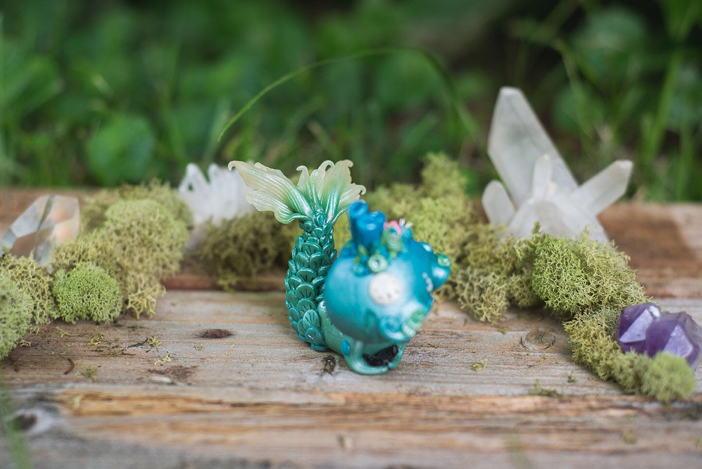 Top Right-Side View of Blue & Green Mermish - handmade polymer clay mermaid creature with coral reef on head holding obsidian