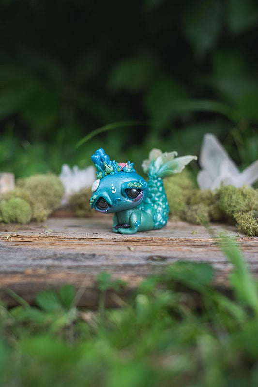 Front View of Blue & Green Mermish - handmade polymer clay mermaid creature with coral reef on head holding obsidian