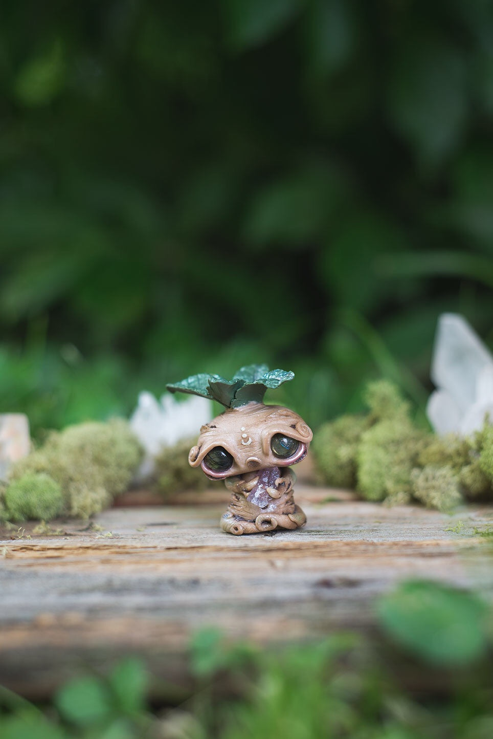 Front View of Beige Mandrake Mish - handmade polymer clay mandrake creature holding fluorite crystal