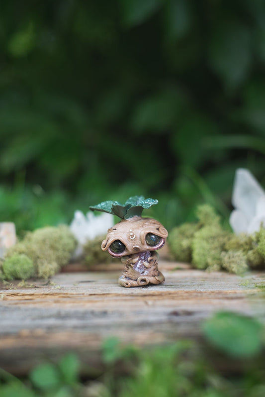 Front View of Beige Mandrake Mish - handmade polymer clay mandrake creature holding fluorite crystal