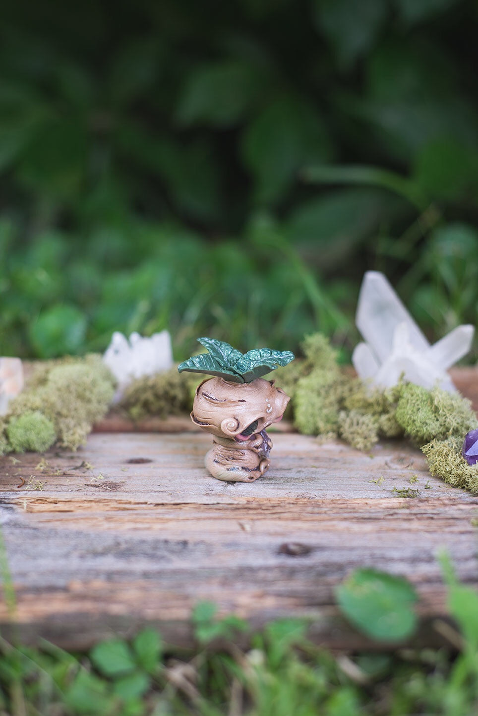 Right-Side View of Beige Mandrake Mish - handmade polymer clay mandragora root creature with holding fluorite